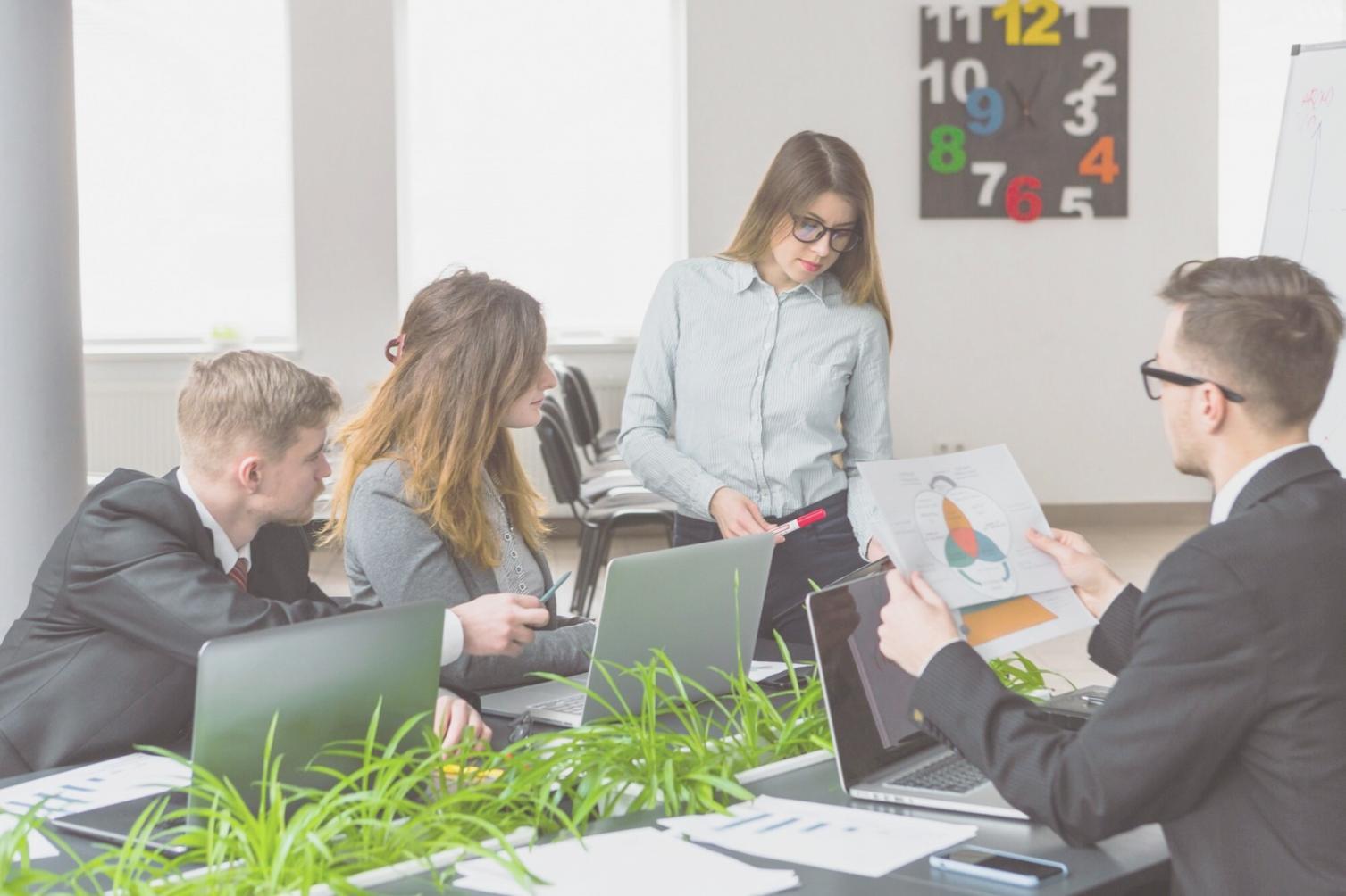Collaborative investment learning session with community members reviewing financial strategies